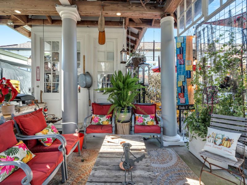 Lush courtyard lounge draped in greenery — perfect for unwinding.