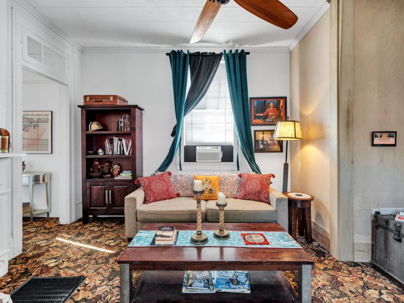 Bright, cozy living room full of classic NOLA charm.