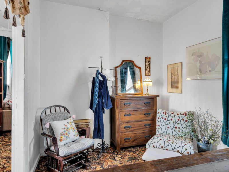 Eclectic bedroom full of local personality & one-of-a-kind charm.