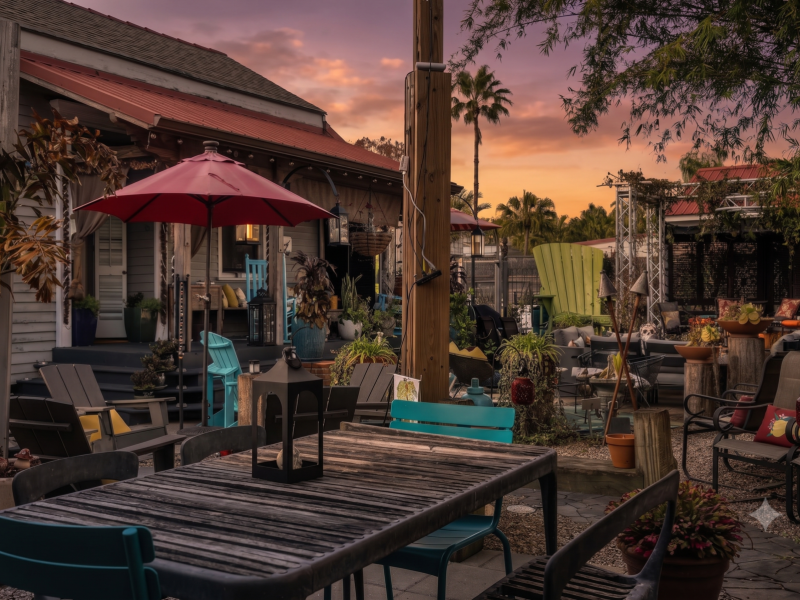 Sunny patio shaded by an umbrella — ideal for morning coffee or evening cocktails.
