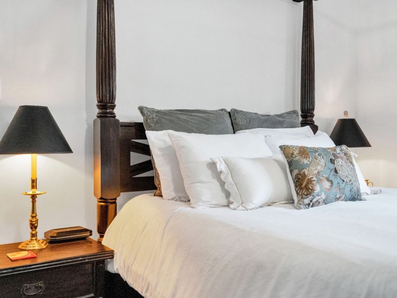 Plush bed dressed in crisp layers for total comfort.