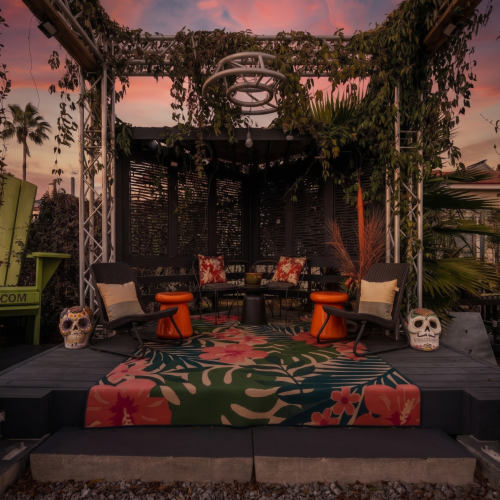 String-lit courtyard perfect for gathering after dark.
