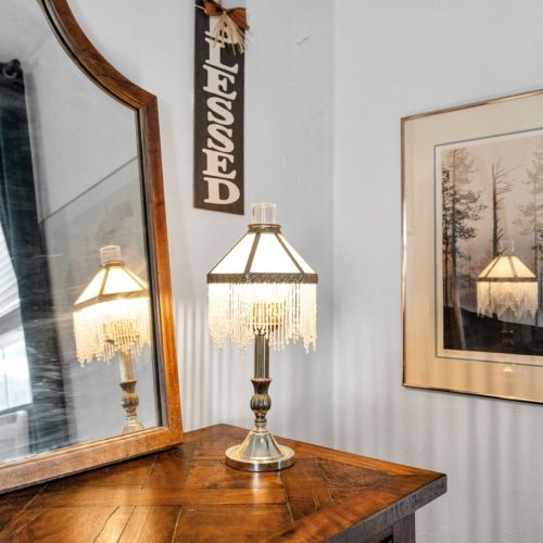 Soft lighting & charming historic accents set a relaxing mood.