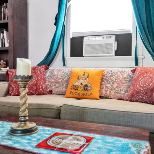 Relaxed living space w/ signature Book NOLA touches throughout.