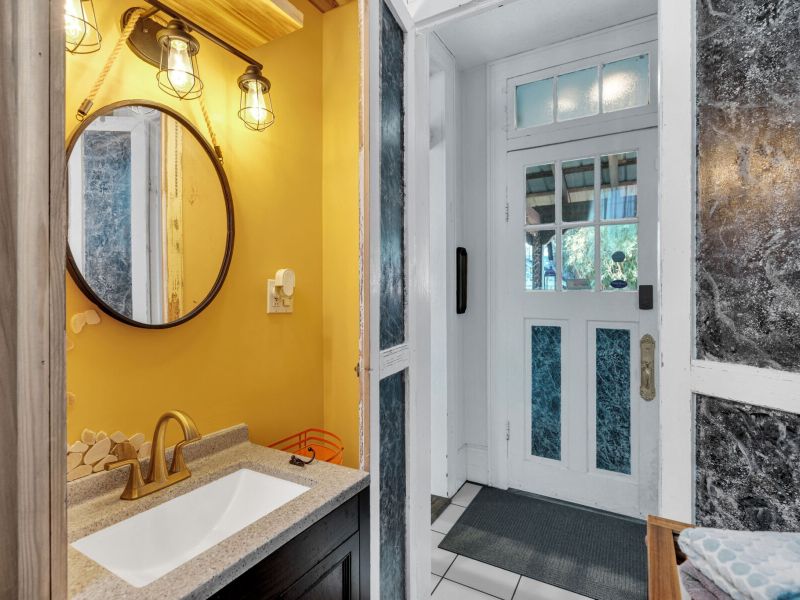 Bold, sunny bathroom w/ vibrant NOLA color & character.