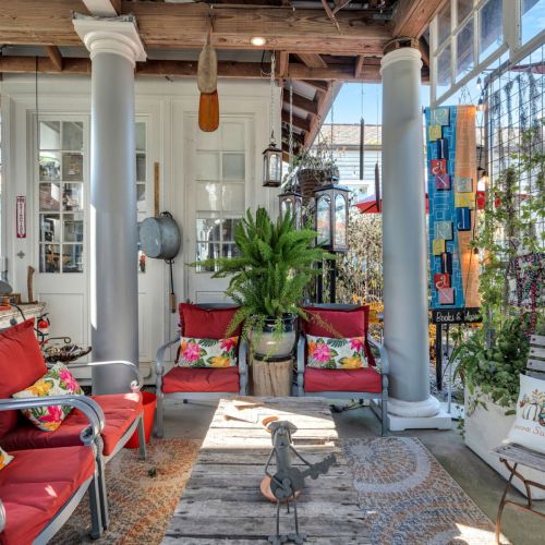 Lush courtyard lounge draped in greenery — perfect for unwinding.