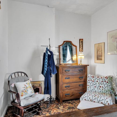 Eclectic bedroom full of local personality & one-of-a-kind charm.