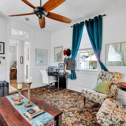 Sunlit living space w/ local flair & vibrant character.