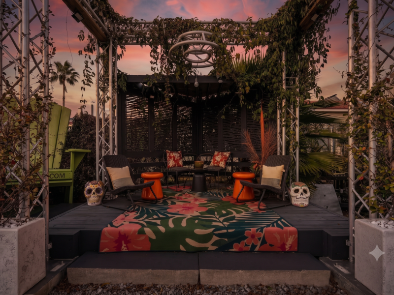 String-lit courtyard perfect for gathering after dark.