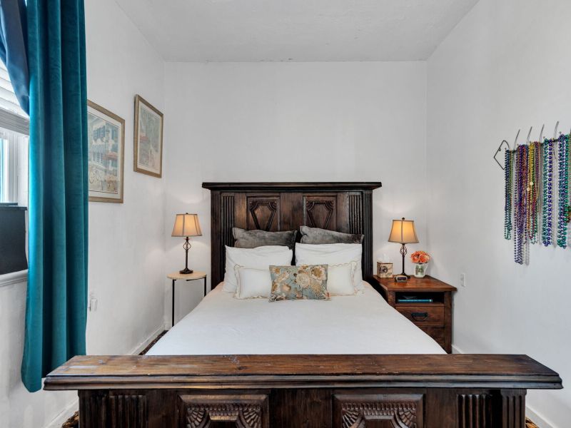 Warm guest bedroom w/ timeless style & inviting comfort.