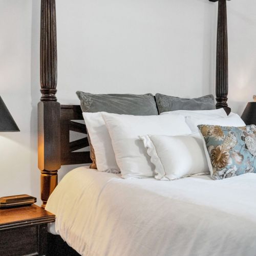 Plush bed dressed in crisp layers for total comfort.